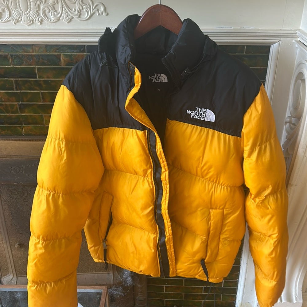 Men’s black and yellow the north face puffer